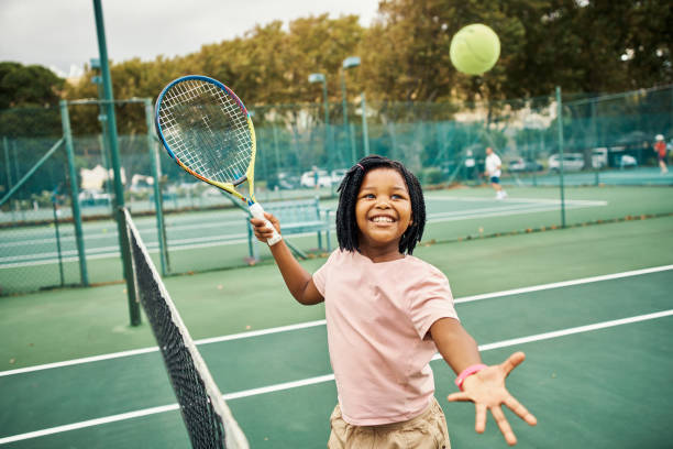 happy kids playing tennis - 2